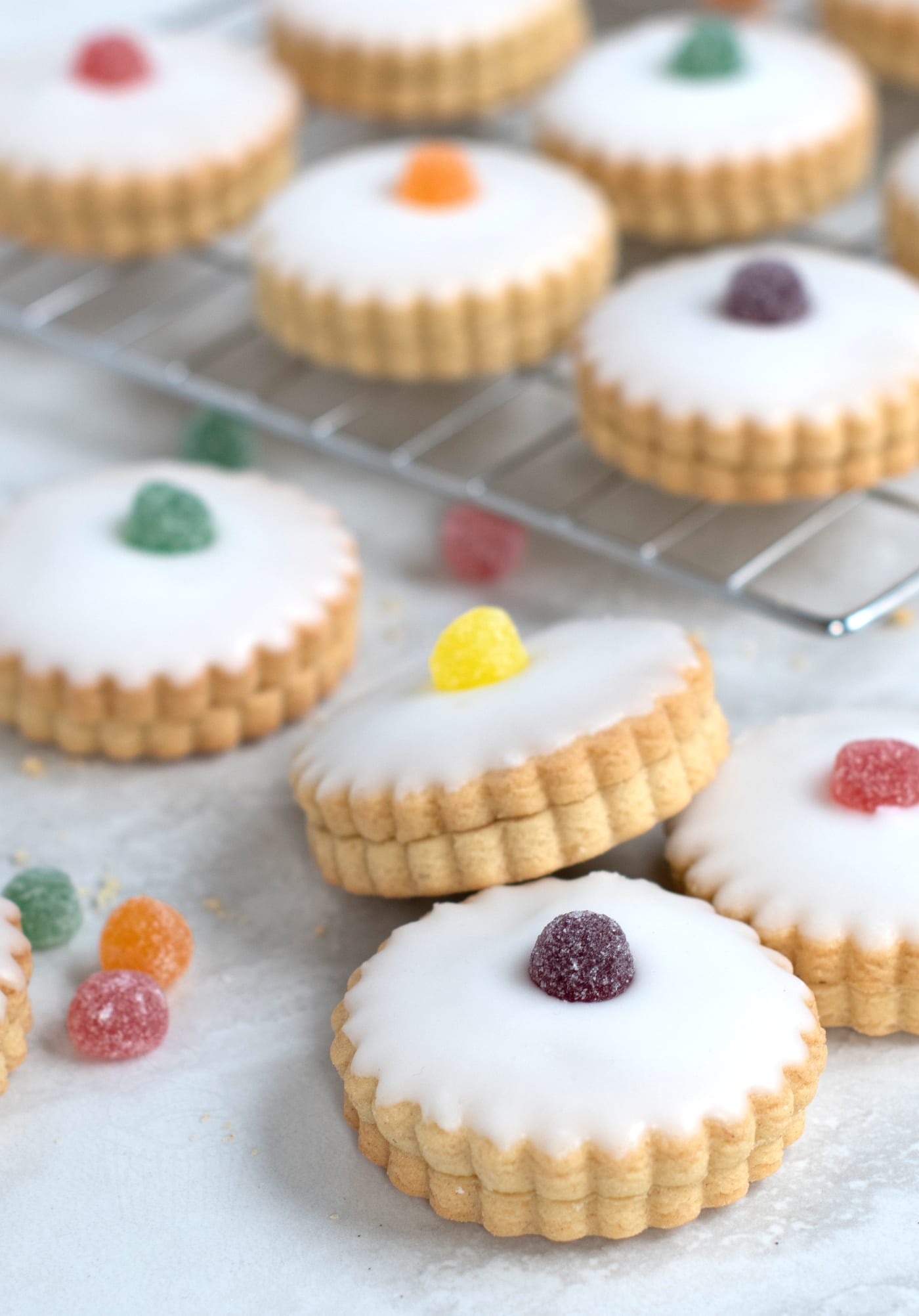 Empire Biscuits recipe from Baking with Granny. Also known as German Biscuits - soft sweet biscuits, sandwiched with jam and topped with white icing and a jelly tot or glace cherry.